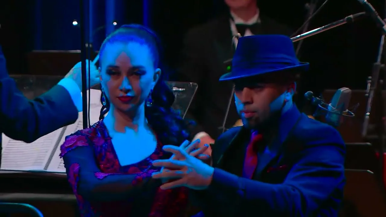 Daniel and Ana dancing tango in front of Ontario Pops Orchestra.