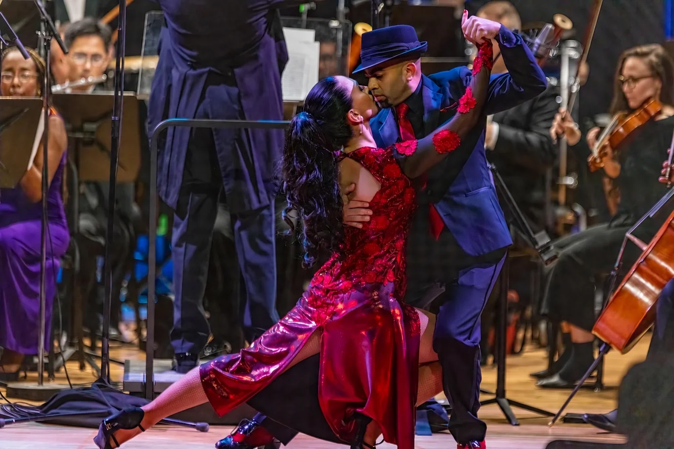 Daniel and his partner performing with a live orchestra.