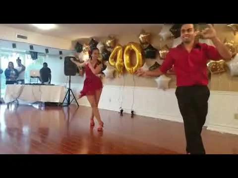 Daniel and Ana performing Salsa at a birthday celebration.