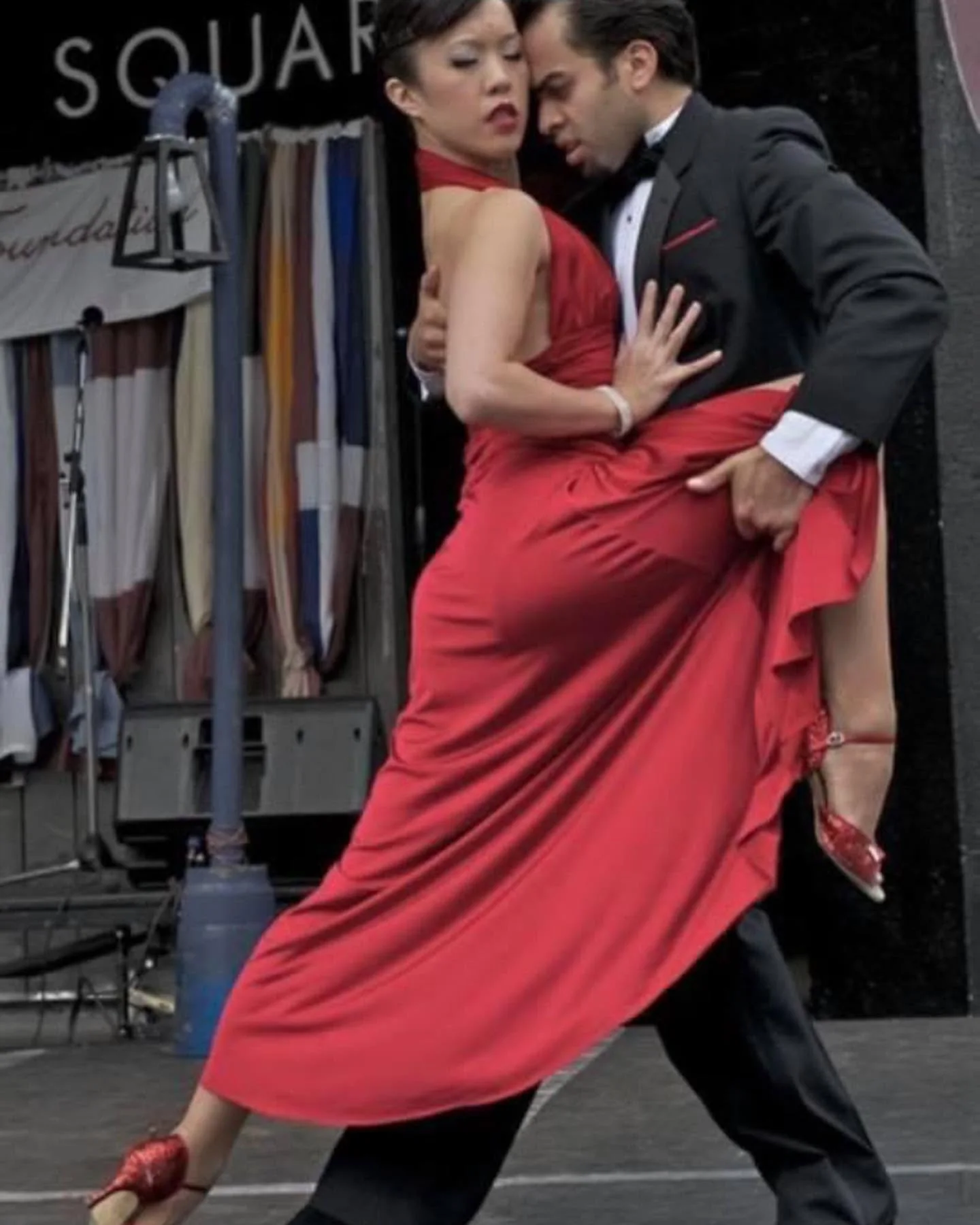 Daniel and his partner performing in a close tango embrace.